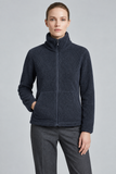 A woman modeling a CLAUDIA C dark navy blue fleece zip-up jacket with a high collar, paired with dark gray trousers, against a solid light gray studio background. This jacket is available to buy from Mooreheads, Bessbrook.